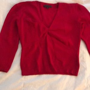 Red Bette Paige sweater. Forms to body